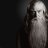 Pixelated grayscale figure with long hair, holding a dark object near its face against a dark background.