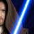 A Star Wars-themed animated icon featuring a character with brown hair and blue eyes holding a glowing blue lightsaber, accompanied by text reading "I'm a STAR WARS geek... And I love it."