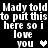 Pixelated text repeats 'Mady told Mady told to put this here so i love you' with heart symbols, one white and one gray on black background.