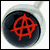 Circular icon with black center and red anarchy symbol on dark background, bordered by light gray ring.