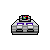 Pixelated gray and black vehicle with purple accents and a small multicolored screen on top, set against a solid gray background.