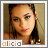 Pixelated portrait of a woman with dark hair, light skin, and red lips, framed with text 'alicia' below.
