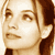 Pixelated static image of a person's face with light brown hair and neutral expression on a white background.