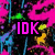 Pixelated image with vibrant pink, blue, green, and yellow abstract shapes on left; white background with purple and blue circles on right; text elements IDK and MYYY in bold colors.