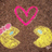 A static image shows two yellow cartoon characters with blue eyes and pink bows, positioned beneath a large pink heart on a brown background.