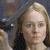 A 50x50 pixel animated contact sheet showing two frames of a buddy icon with a person holding an object on the left and green text on a dark background on the right.