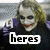 A four- shows a character with white face paint, red lips, and messy blonde hair in a dark jacket with purple accents. Text overlays read 'heres', 'my', 'card', and '-joker'