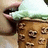 A pixelated image shows a person eating ice cream with a black background displaying 'ICE CREAM' text.