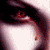 A static close-up of a pale face with dark hair, red eyes, and a single tear falling from the right eye.