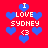 Red background with blue pixelated hearts and white text reading "I LOVE SYDNEY <3" in a repeating pattern.