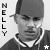 A black-and-white animated contact sheet showing two frames of a person wearing a cap and hoodie with the name "NELLY" vertically displayed on both sides, featuring star symbols at the bottom corners.