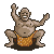 Pixelated figure with brown skin, bald head, and open mouth showing white teeth, wearing orange patterned loincloth in squatting pose with raised arms.