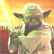 Green-skinned alien with large ears holds a glowing yellow lightsaber against an orange-yellow gradient background.