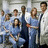 A pixelated group of medical professionals in blue scrubs and white coats stands together, with red text reading 'i love greys anatomy' on the right side.