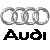 Four interlocking silver rings above bold black text reading 'Audi' on a light gray background.