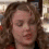 A person with curly brown hair and a red top appears in three distinct facial expressions