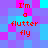 Pixelated text 'I'm a flutter fly' in red appears on a of blue and purple squares with cyan accents