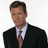 A pixelated image of a man in a dark suit and tie with a red background displaying text about Chris Hansen and Dateline NBC.