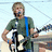 Pixelated image of a person with light brown hair and beard holding an electric guitar, wearing a dark green shirt with blue strap.