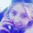 A pixelated image of a person holding a phone, with blue background and white text reading "Hey, it's my girl Erin! I Love Her <333".