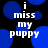 Black background with blue circular shapes and white text reading "i miss my puppy" in a pixelated font.