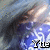 Pixelated image with blue and gray tones showing a figure in motion against a blurred background, featuring black text at the bottom right.