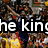 Pixelated image with bold white text 'he king' on black background, surrounded by multicolored pixel clusters in brown, yellow, red, blue, and gray tones.