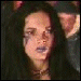 Four- shows a person with long dark hair in three and a purple text , with visible facial expressions changing