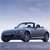 Pixelated blue convertible car with black wheels and a visible driver, set against a light blue gradient background.