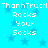 Pixelated text 'ThanhTruck Rocks Your Socks' repeated twice on a bright cyan background with faded blue stars.