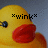 Pixelated yellow duck face with red beak, black eye, and *wink* text above, against gray background.