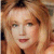 Static pixelated image of a person with light brown hair, fair skin, and a neutral expression, cropped to show upper face and shoulders.