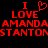 Red pixelated text on black background reads "I ❤️ LOVE AMANDA STANTON" with repeated text elements and a heart symbol.