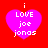 Four identical pixelated heart-shaped icons with white text on a red background, each displaying 'i LOVE joe jonas' in a