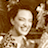 Static 48x48 pixel icon showing a low-resolution grayscale image of a person with light skin tone and dark hair, partially cropped on the right side against a brown background.