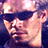 Pixelated static image of a person's face with dark hair and light skin tones, rendered in low-resolution 256x256 pixels using a limited color palette.
