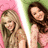 Two pixelated figures with long hair, one in pink background and the other in green, both smiling.