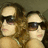 Two people with sunglasses in a pixelated photo on a bright pink background with cyan text reading 'yeah', 'be jealous', and 'stay jealous'.