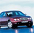 Pixelated side view of a blue sedan with red accents on a light blue background, showing visible wheels and windows.