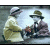 Two figures in vintage attire sit at a table, one holding an object; green text reads 'Original Icons .com' on the right.