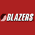 Red background with white pixelated text 'BLAZERS' and a partial dark red curved shape on the left.