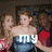 A pixelated image of two women in formal dresses with overlaid text changing across frames.