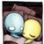Two overlapping speech bubbles with a blue and yellow character, one displaying text in black boxes.