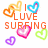 Pixelated graphic with orange text reading 'I LUV SURFING' surrounded by six colorful heart shapes in yellow, blue, pink, green, and purple hues.