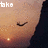 A pixelated face with closed eyes and a small light below, showing text changes from 'take' to 'a' to 'chance' across frames.