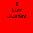 Red background with black pixelated text reading "I Luv Justin!" in two identical vertical