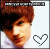 Pixelated close-up of a person with brown hair and blue eyes, featuring text overlay 'YANESSA HEARTS DOUGIE' and a hand-drawn heart symbol on white background.