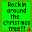 Green background with black text reading "Rockin around the christmas tree!!!" and a red pixelated star in bottom-right corner.
