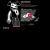 Pixelated figure in dark clothing stands beside a computer monitor with a red circular element on screen, set against black background.