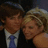 Pixelated image of two people in formal attire with a blue background and pink text reading 'HOW ABOUT NEVER GOING' in the top-right quadrant.